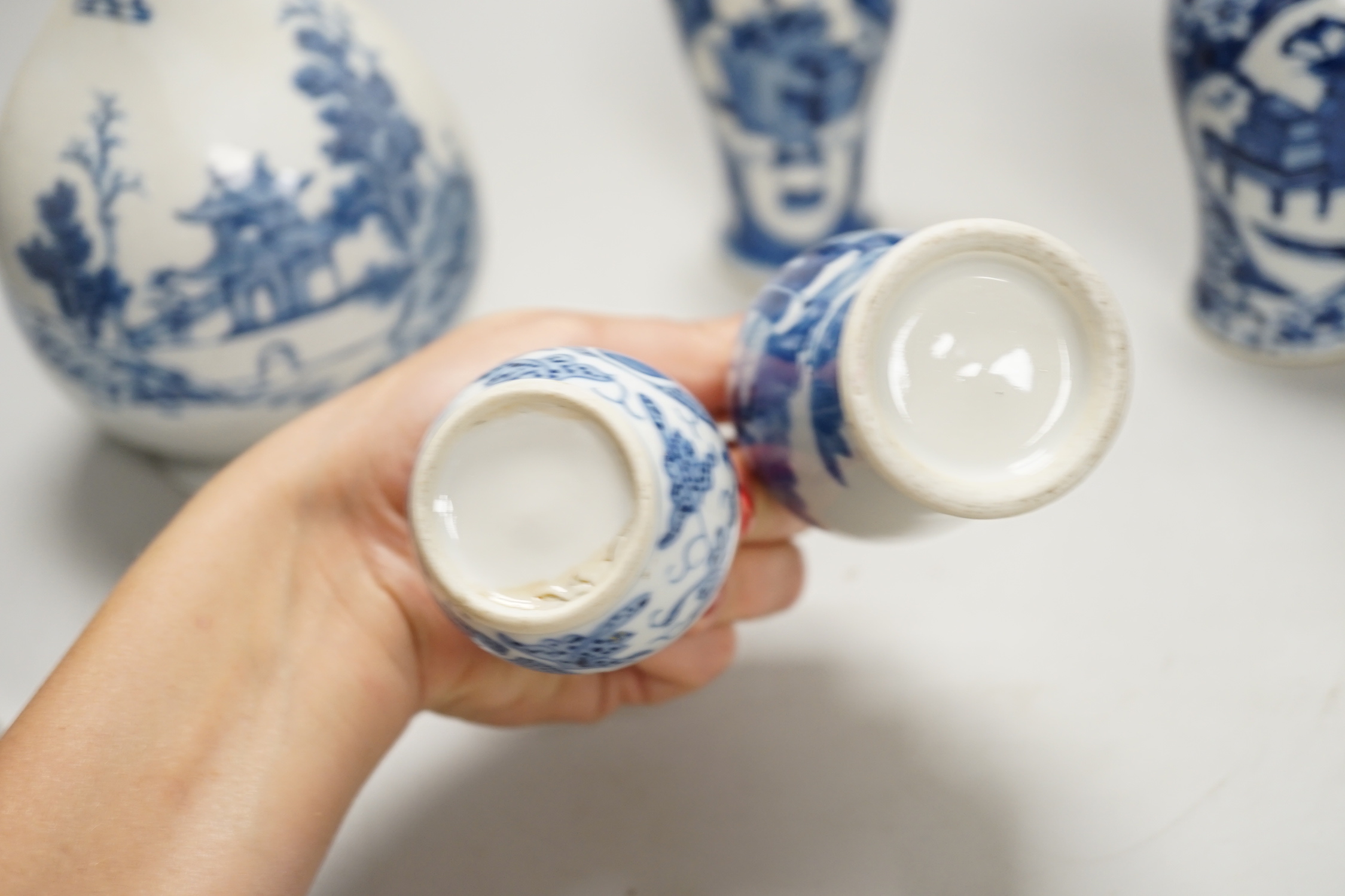 A Chinese armorial blue and white bottle vase, Qianlong/Jiaqing period, and five assorted 19th century Chinese blue and white vases, tallest 20cm; faults